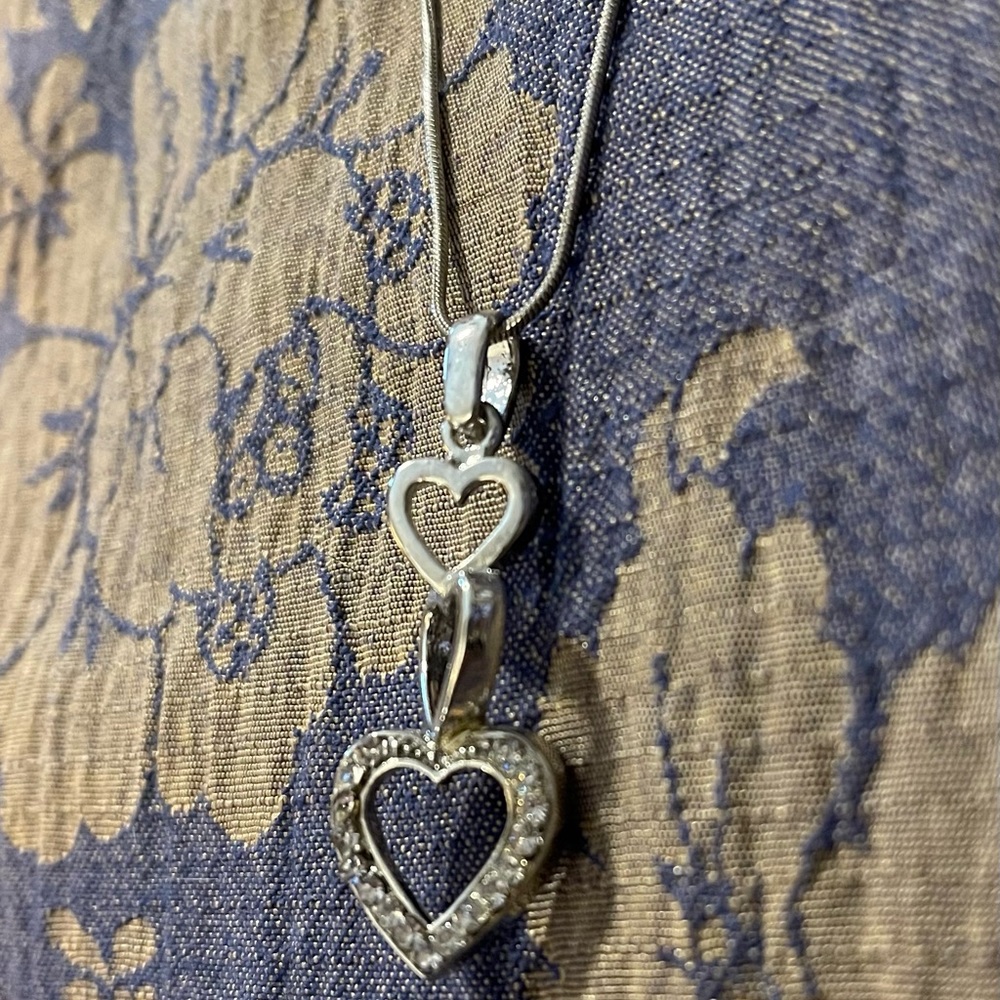 Silver heart necklace with white stones. New in box.